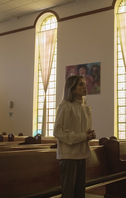 Woman Praying in Chapel