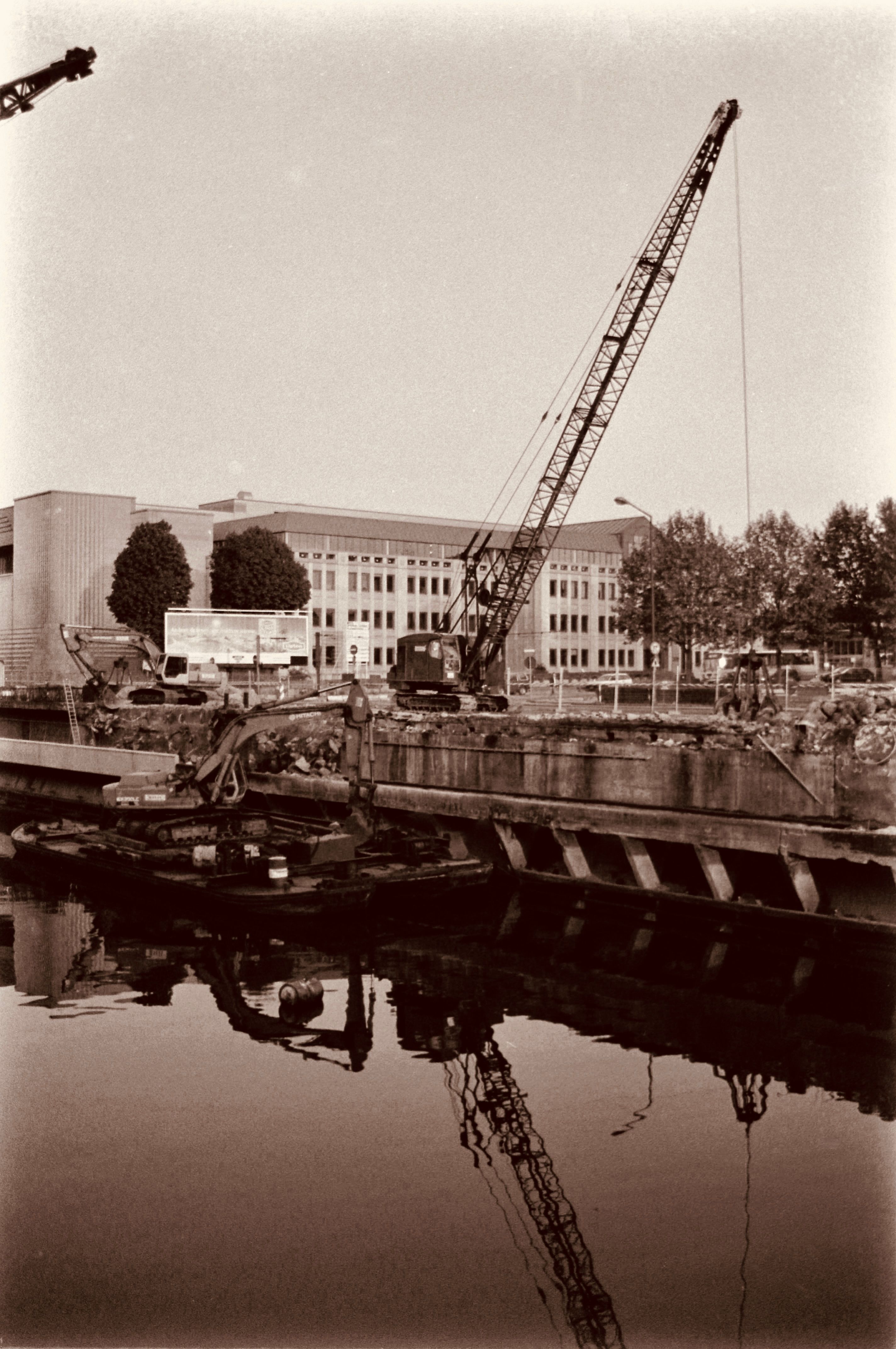 Black and White Photo of Construction Site and Crane · Free Stock Photo