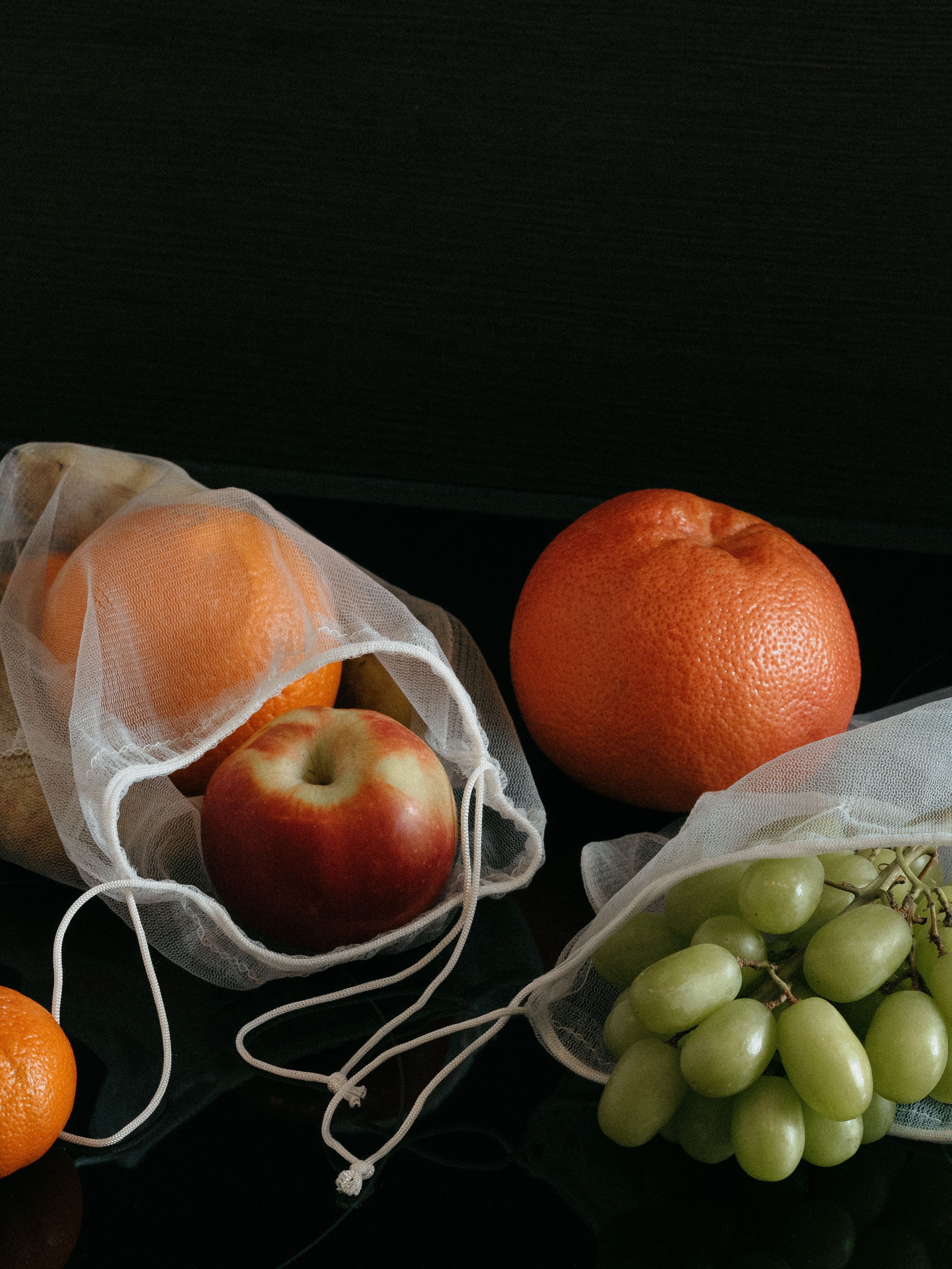 Fruits in White Nets with String · Free Stock Photo