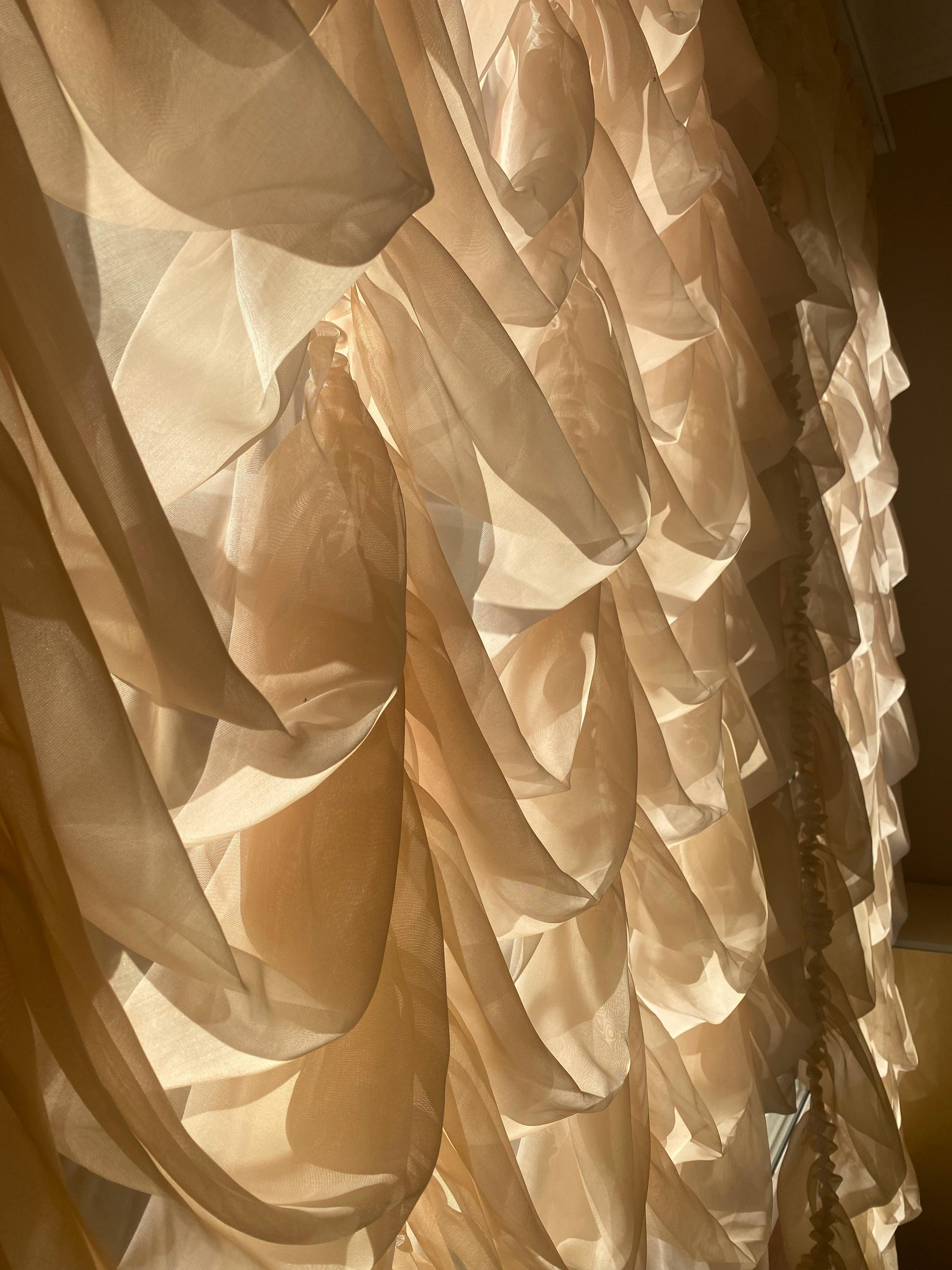 Close-Up Of Tulle Curtains On Light · Free Stock Photo