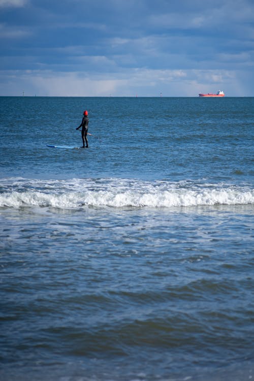 Man Surfing in a Sea 