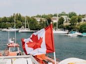 A canadian flag flying on a boat
