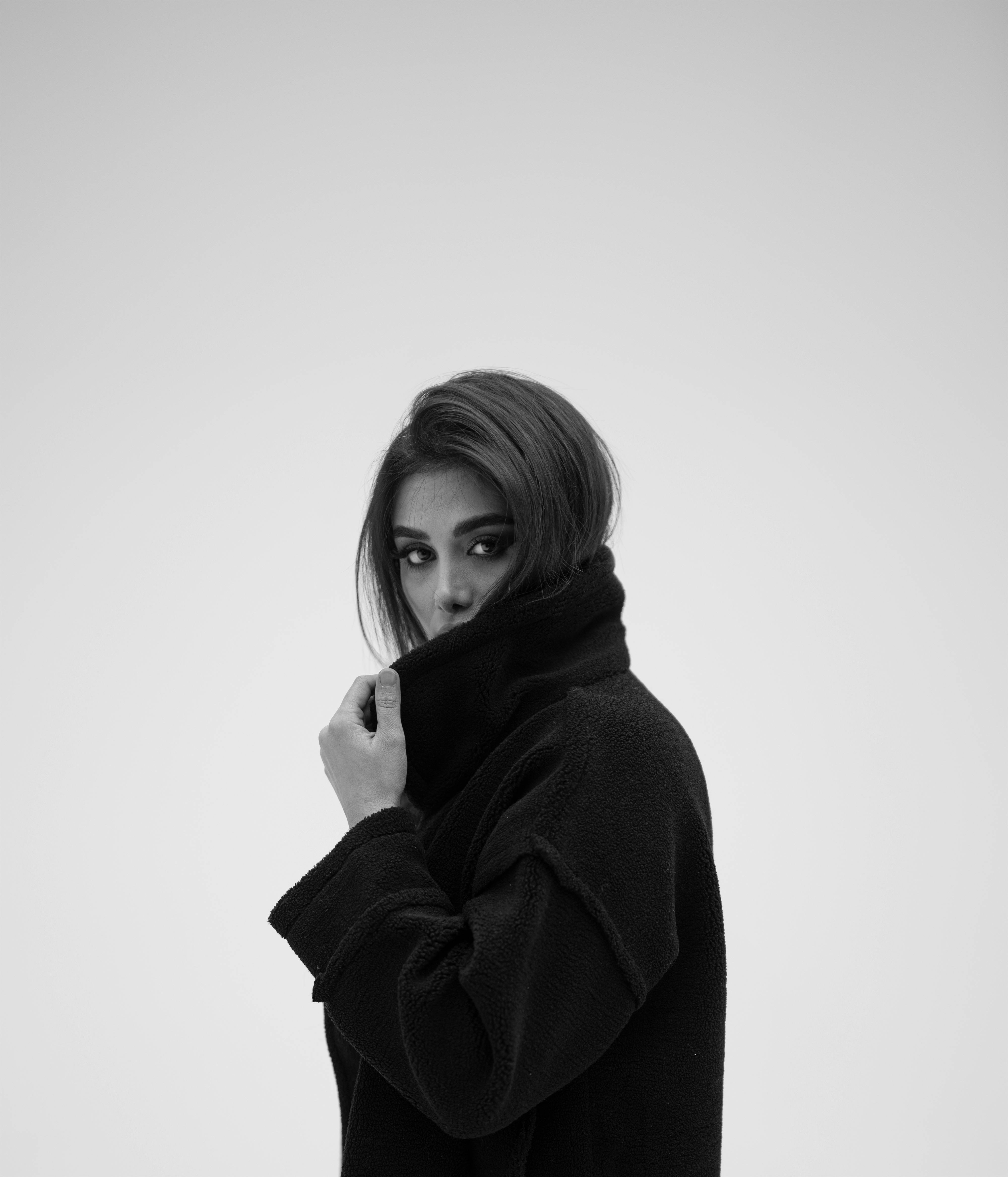 Black and white portrait capturing elegance and fashion in a classic style.