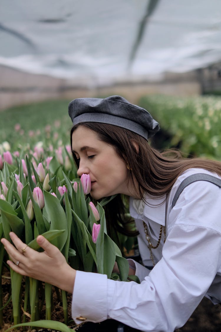 Photo Of A Woman Smelling Flowers 