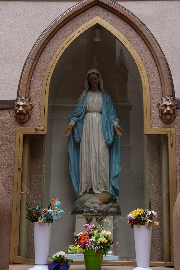 Mary Statue Behind Glass In Church