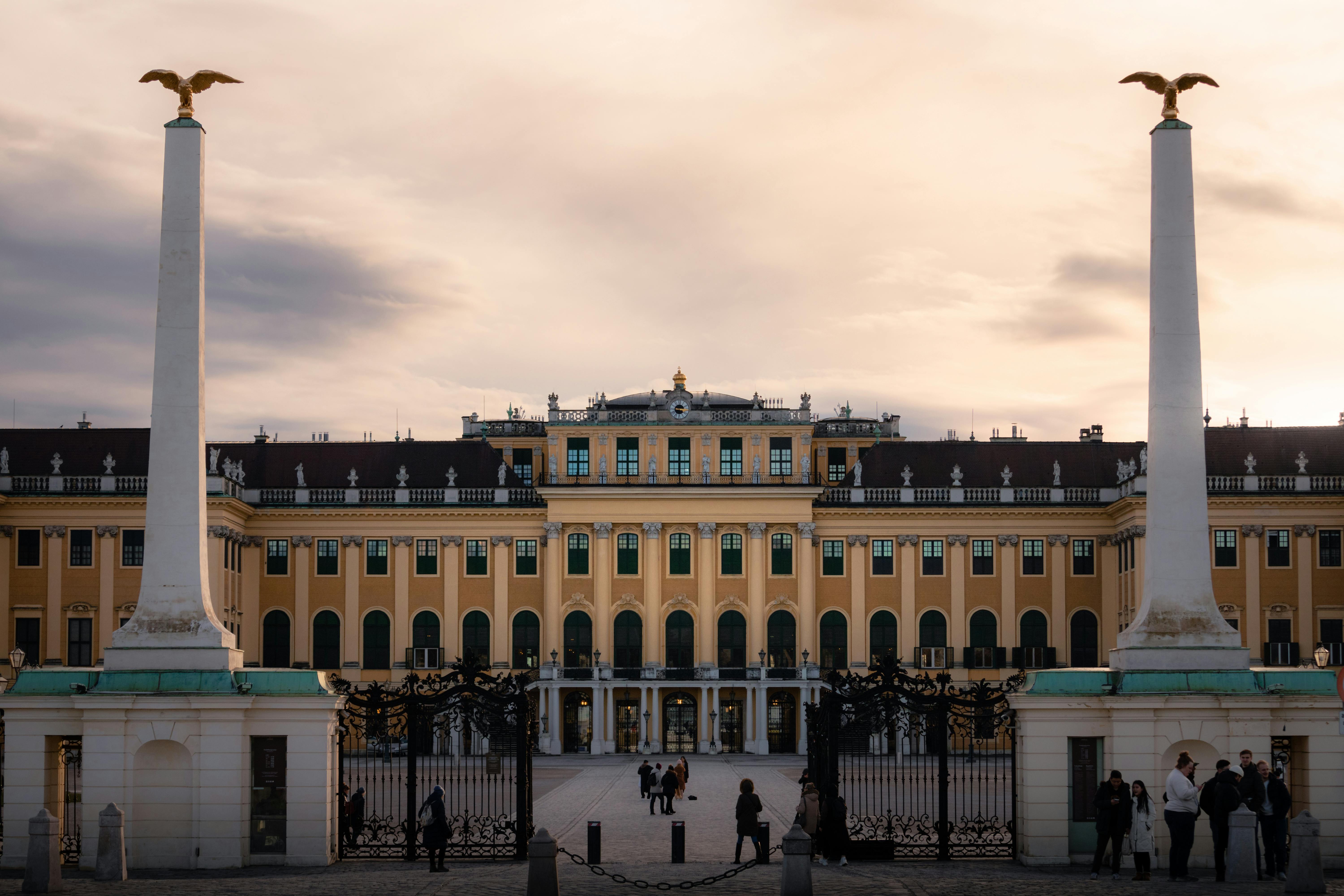 a large building with columns and statues