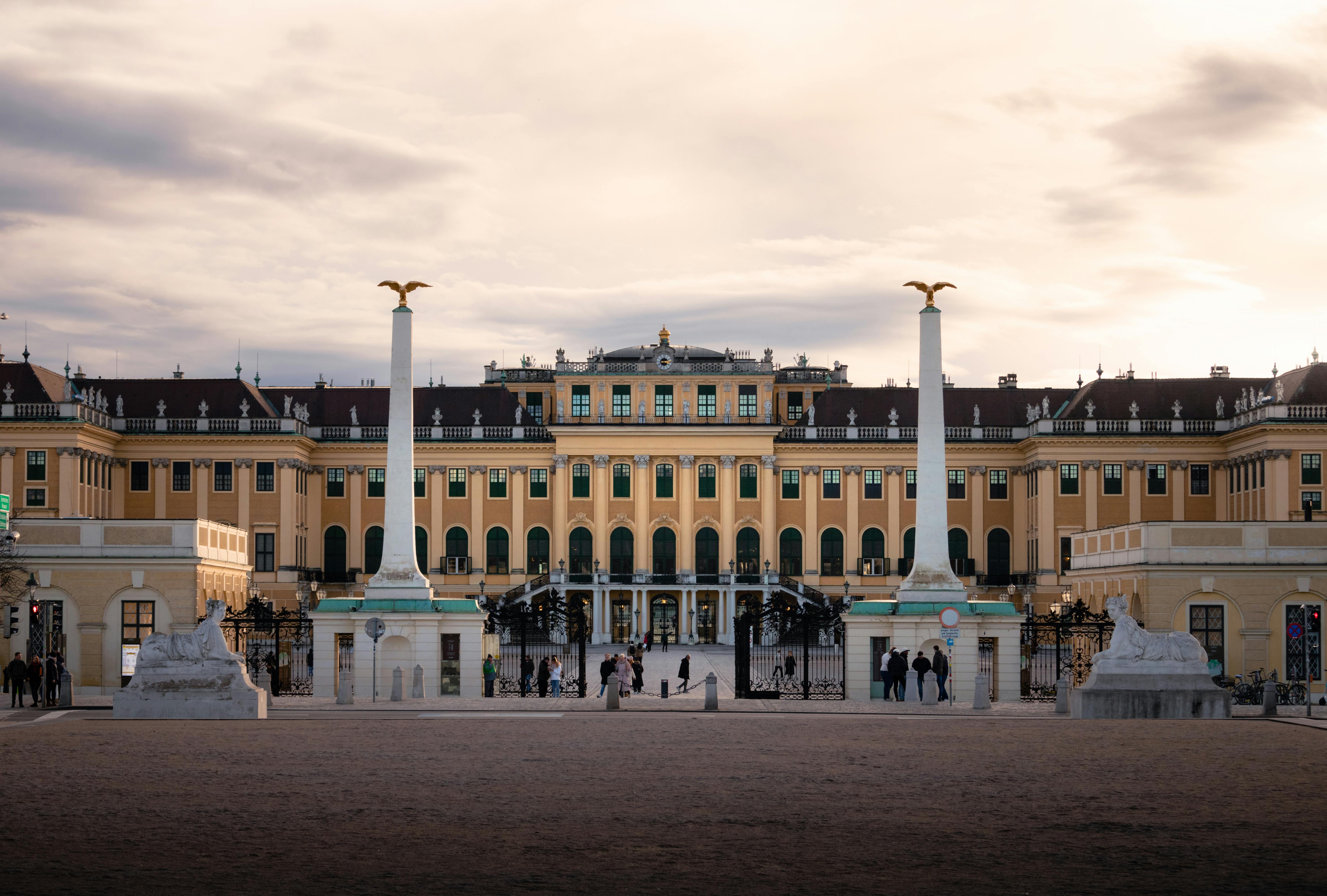 a large building with columns and statues