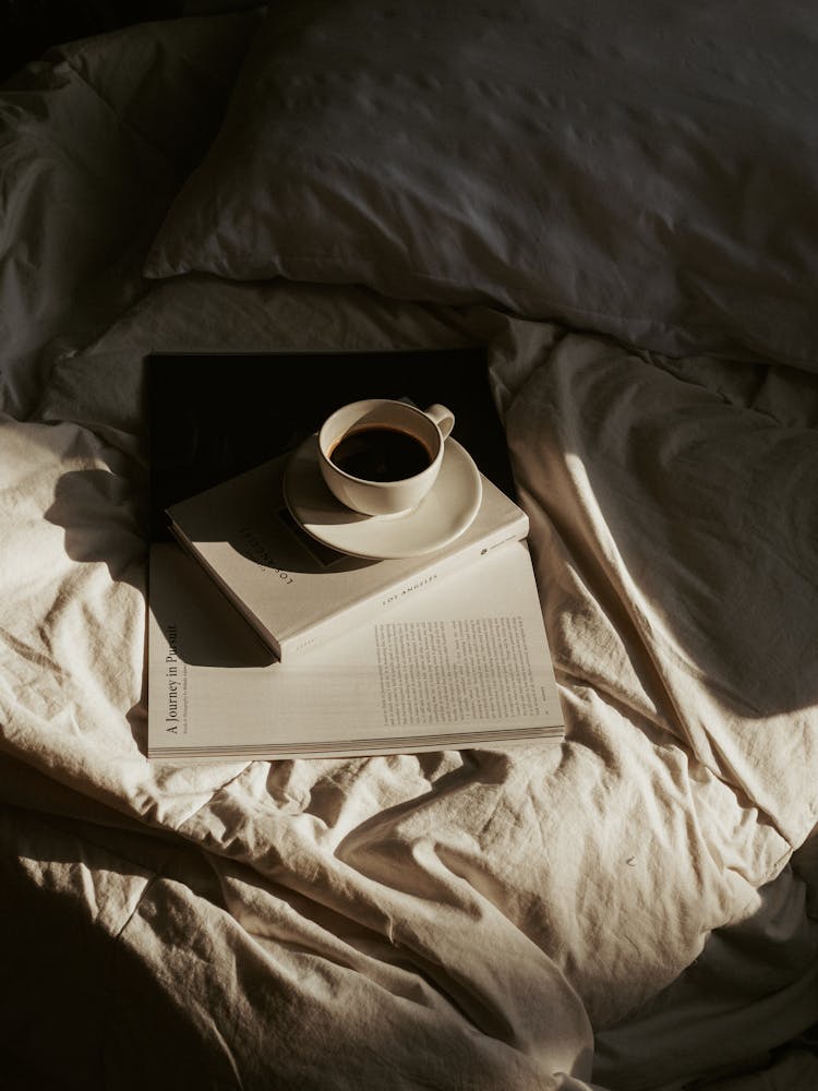 Cup Of Coffee On A Book 