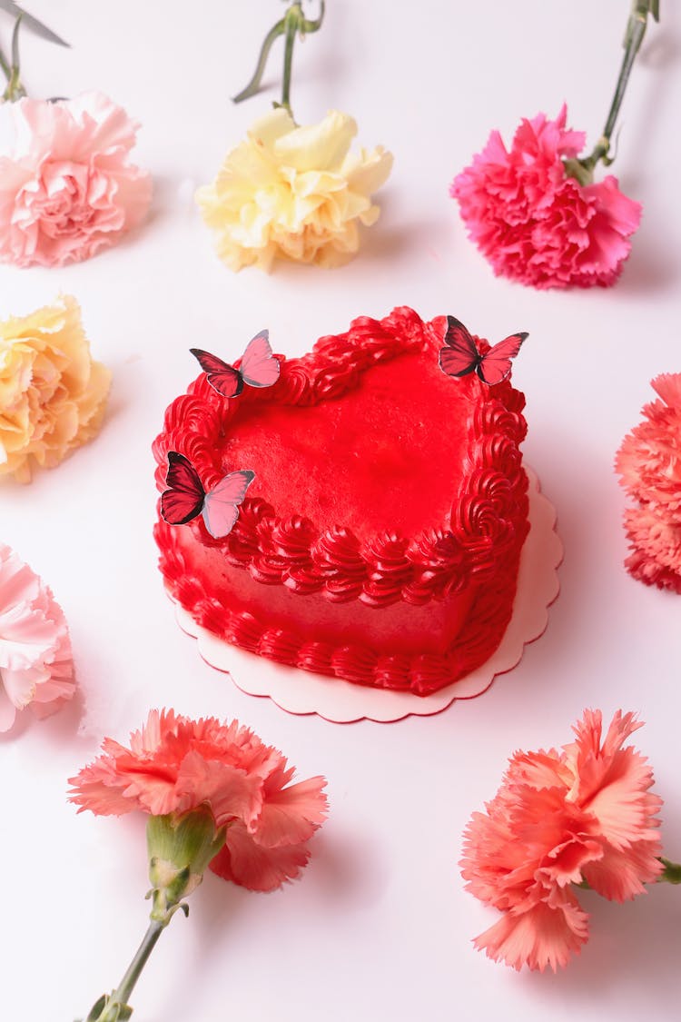 Flowers Around Cake In Heart Shape