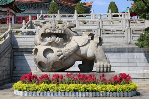 A Statue of a Lion in front of a Temple in Guangzhou, China 