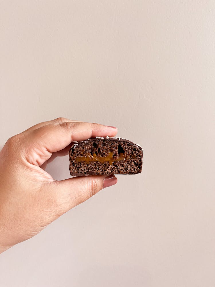 Holding A Chocolate Cookie With Filling