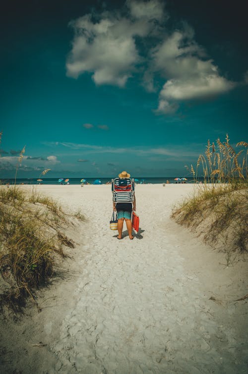 Free Man in Black Top on White Sand Stock Photo