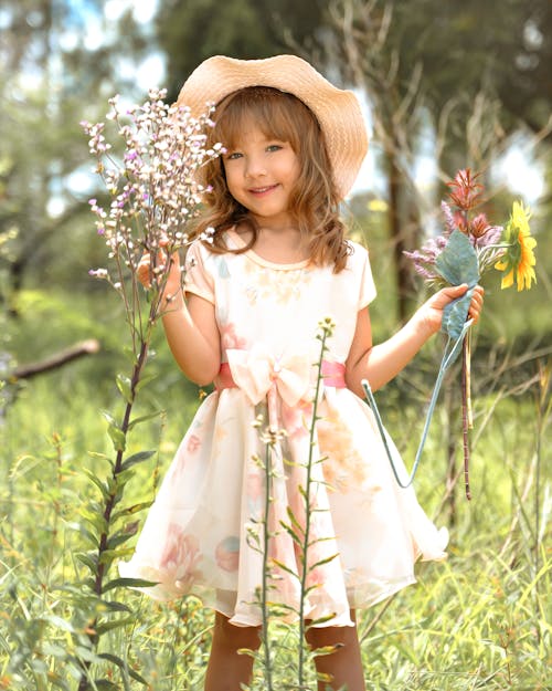 Girl Posing in Dress and with Flowers