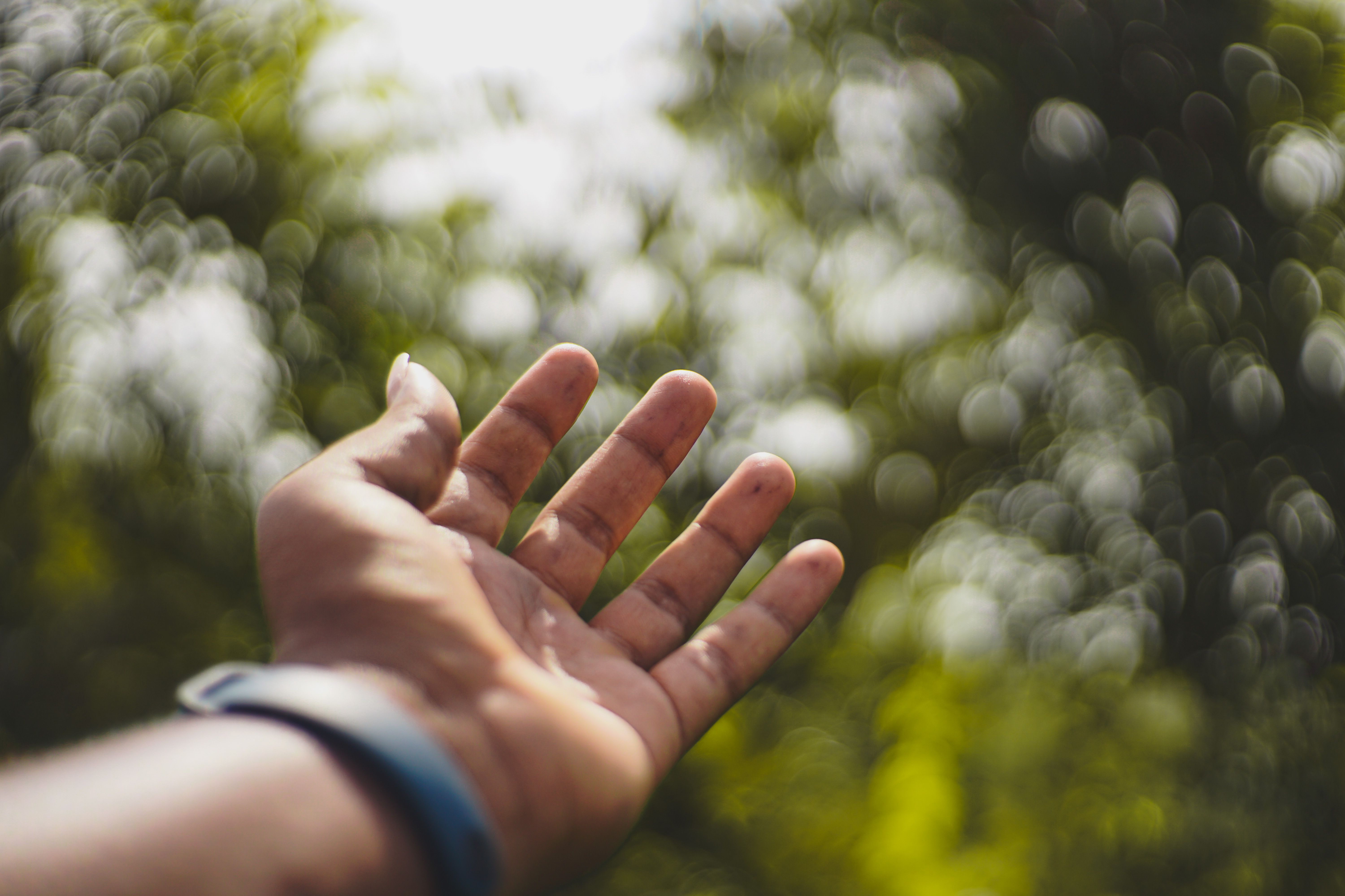 open hand holding compass outdoors