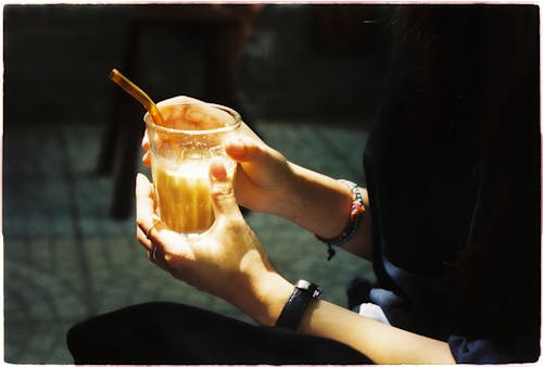 A Person Holding a Glass 