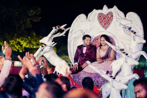 Bride and Groom Sitting in Throne