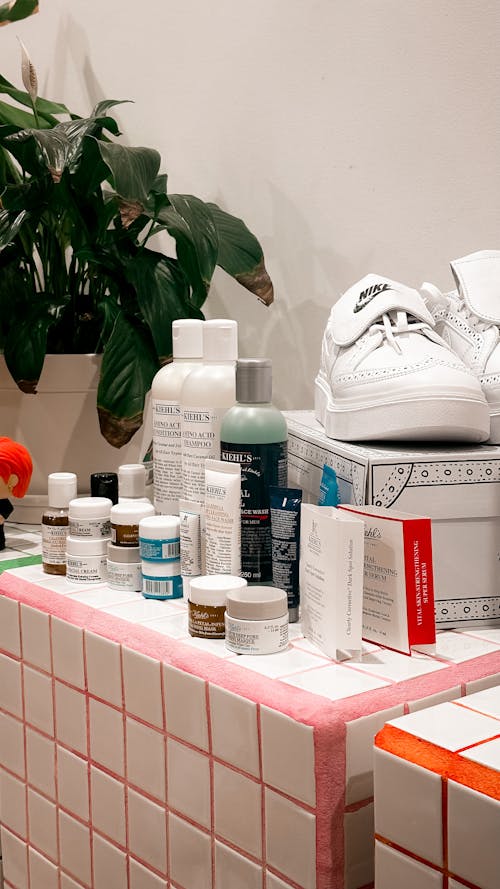 Shoes and Bottles in a Bathroom 