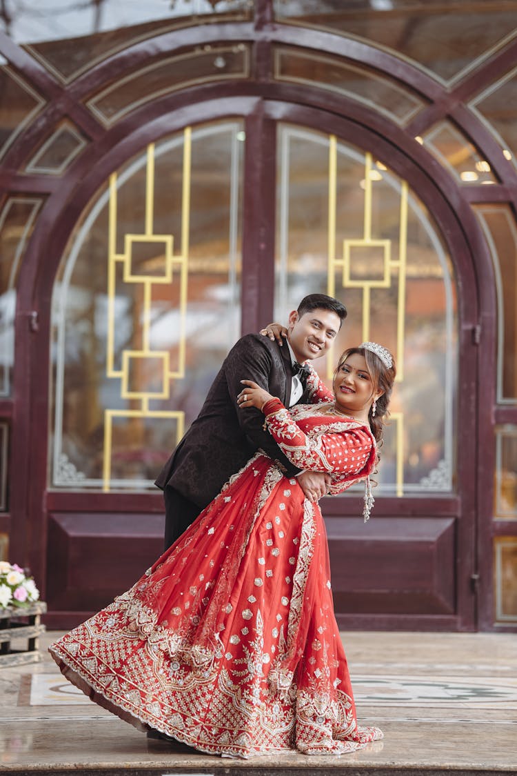 Happy Man Posing With Woman In Dress