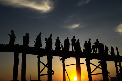 Silhouettes of People on the Pier