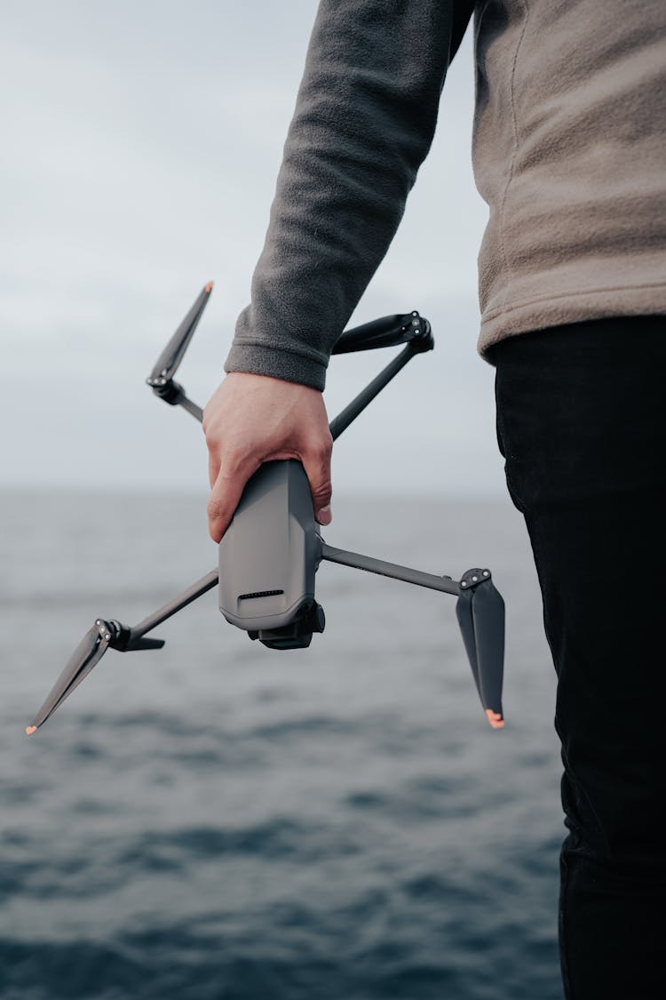 Man Holding Drone In Hand