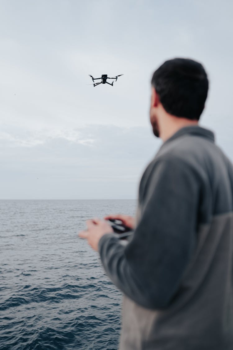 Man Controlling Drone In Air