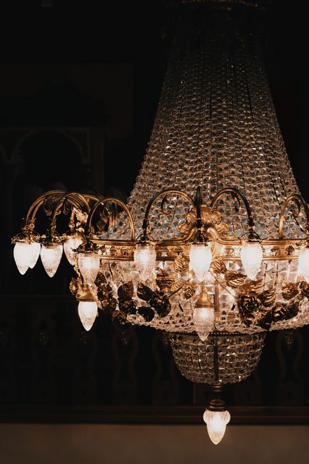 Classic crystal chandelier with warm glow for luxury interior decor.