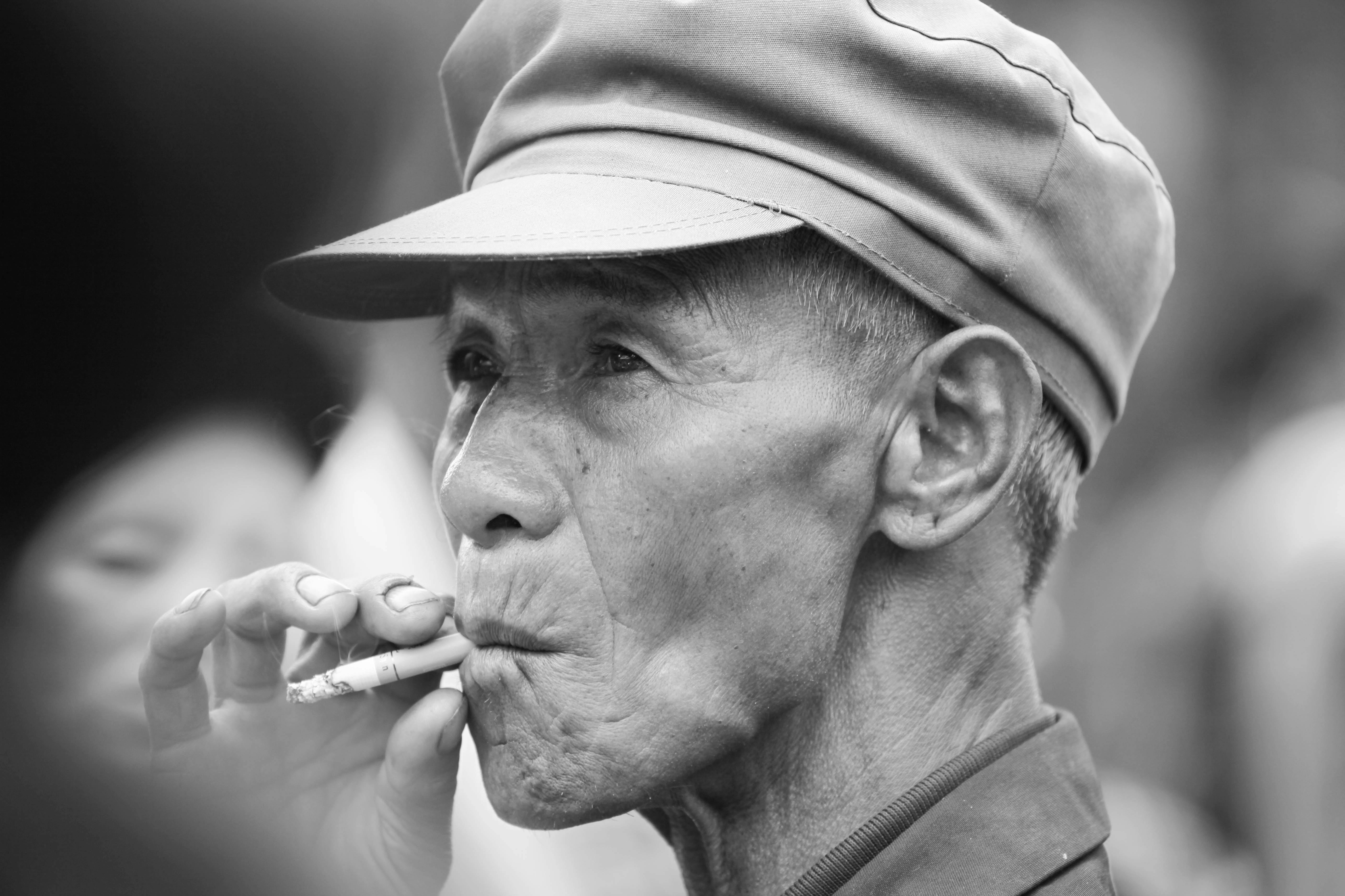 Elderly Man in Hat Smoking Cigarette · Free Stock Photo Elderly Man in Hat Smoking Cigarette · Free Stock Photo