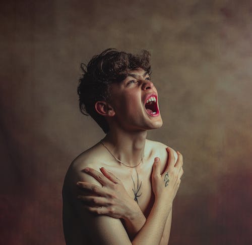 Free Shirtless Boy Screaming Stock Photo