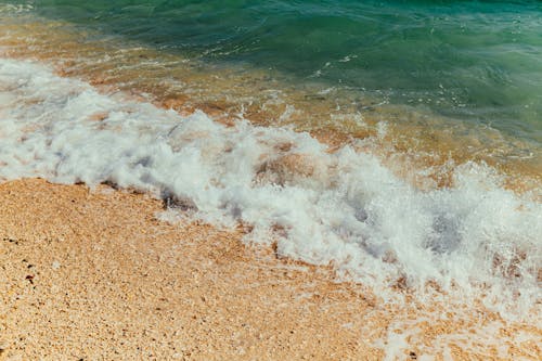 Kostenloses Stock Foto zu meer, sand, schaum