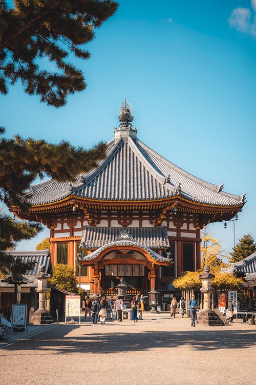 Free Beautiful Japanese temple with tourists during the day, highlighting traditional architecture. Stock Photo
