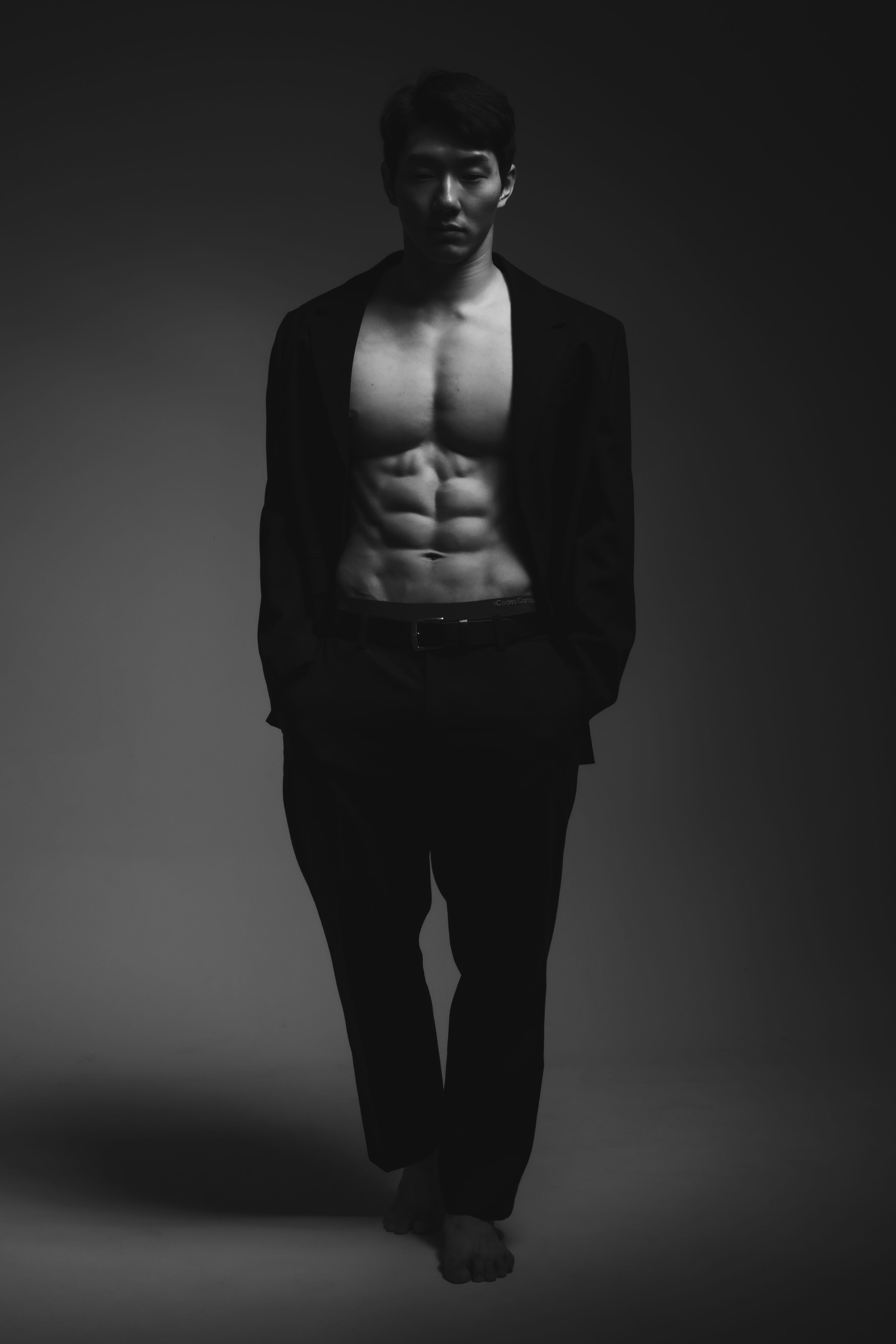 muscular man in a suit