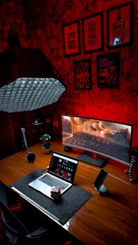 Modern home office setup with laptop, Rubik's Cube, and ambient lighting, perfect for creativity.
