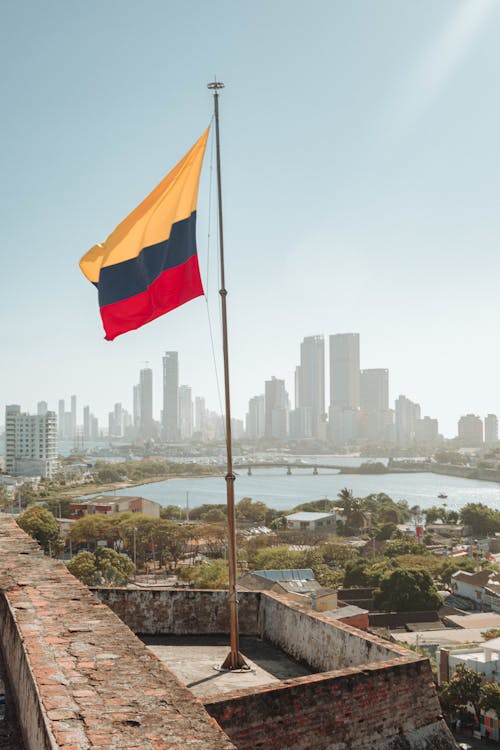 Free Colombian Flag on the Background of the Cartagena Skyline Stock Photo