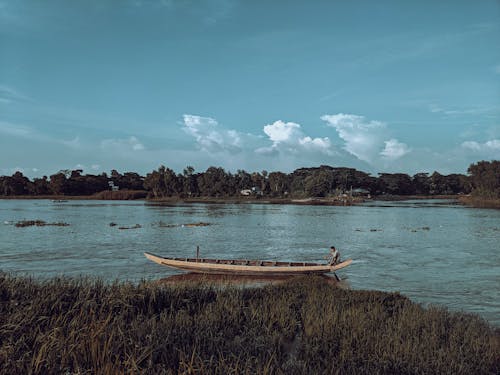 Man in a Canoe on a River 