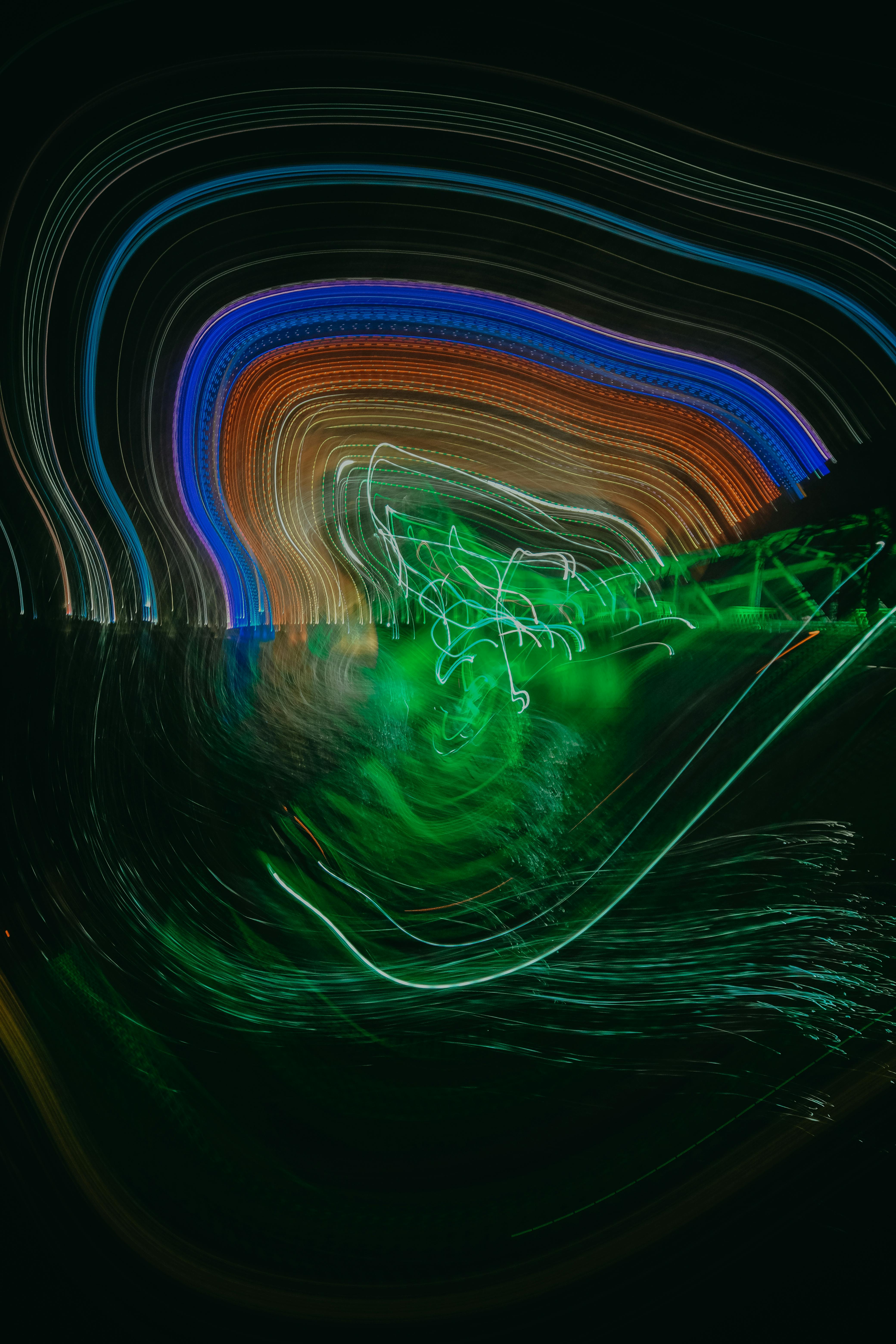 Captivating colorful light trails creating dynamic patterns and shapes, showcasing motion and energy.
