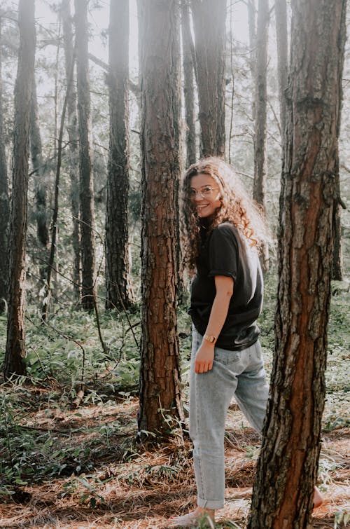 Young Woman Walking in a Forest