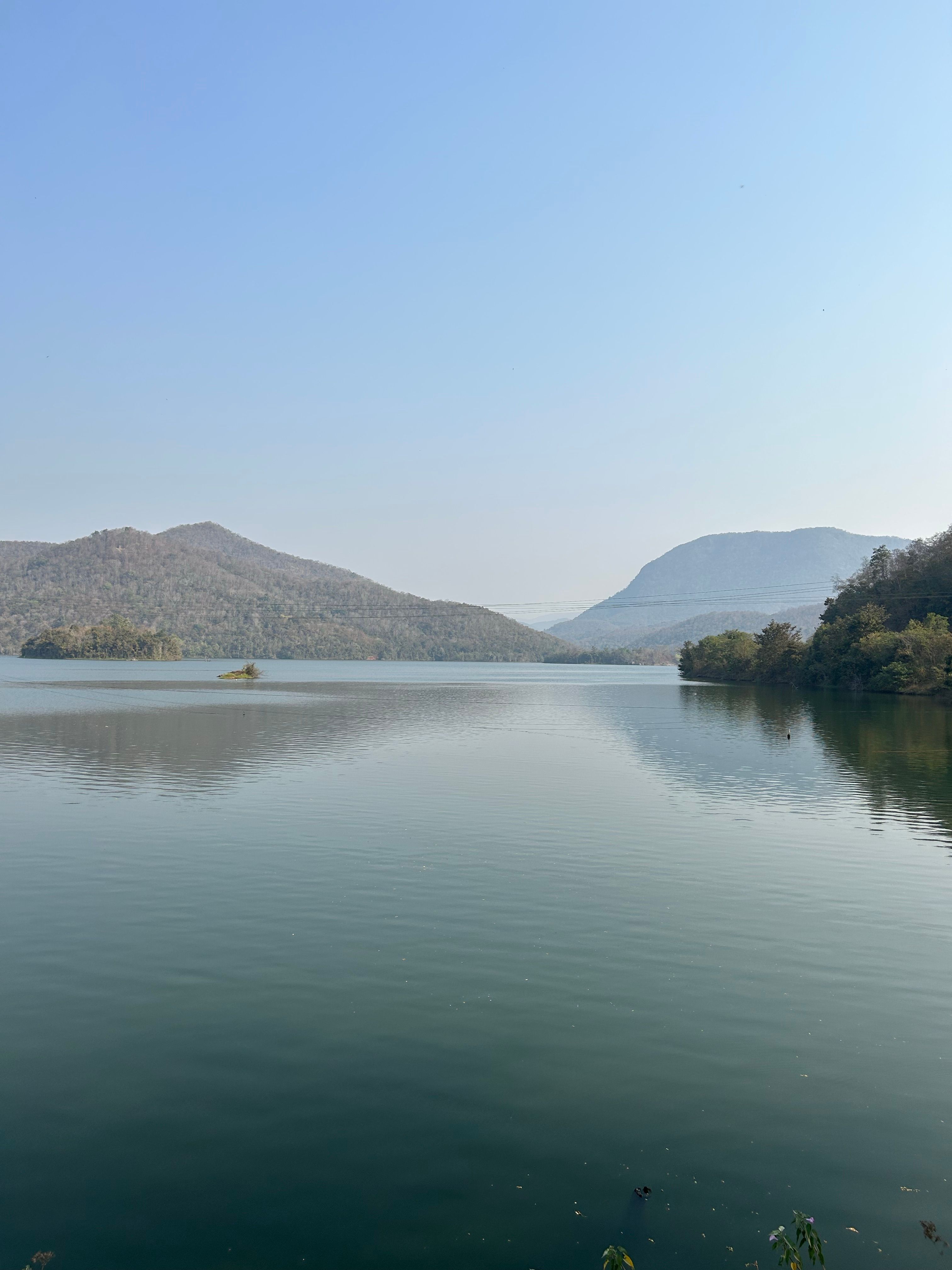 Tranquil Landscape with a Lake and Hills · Free Stock Photo