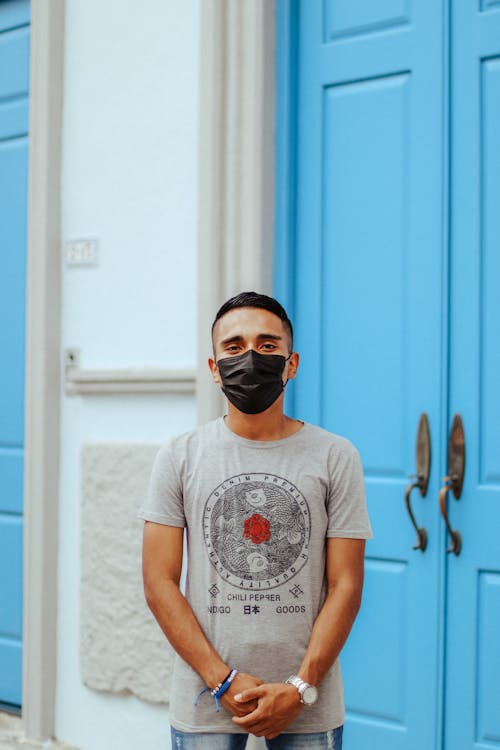 Man Standing in a Black Medial Mask