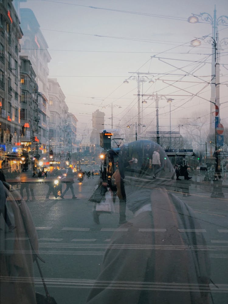 Silhouettes Of People On Street In City