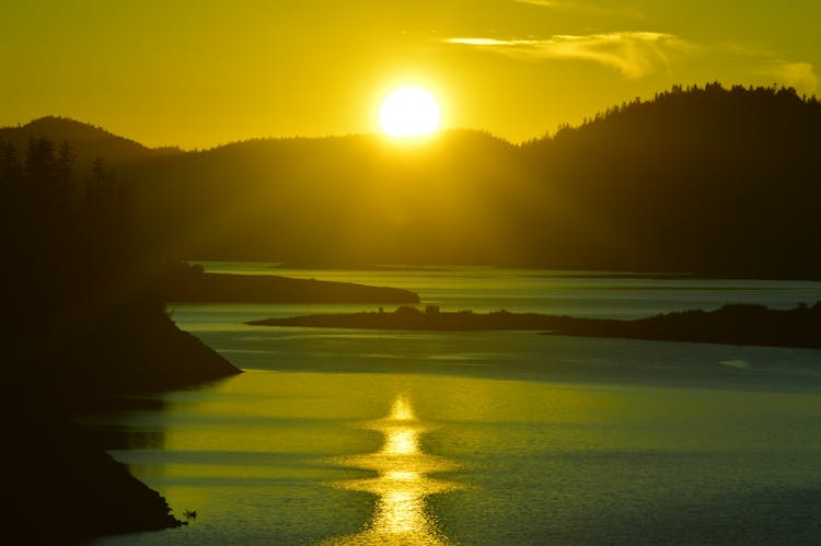 Sunset Over Hill By Lake