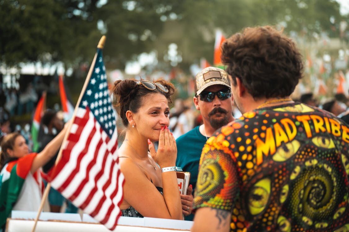 People Celebrating with a Flag of the USA 