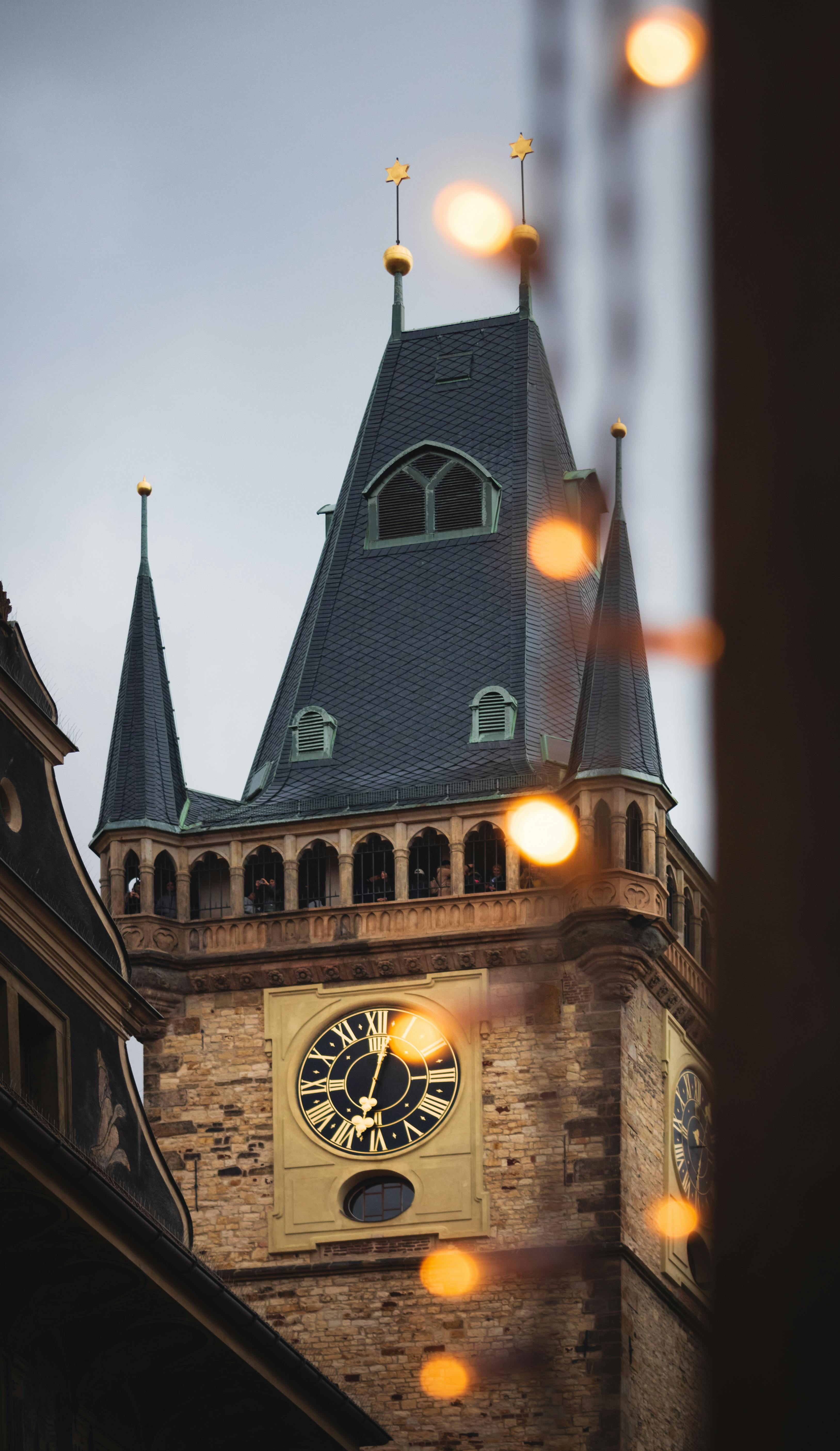 a clock tower with lights on it