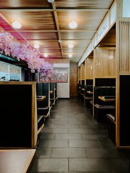 A beautifully designed Japanese restaurant interior with cherry blossom decor and wooden furnishings.