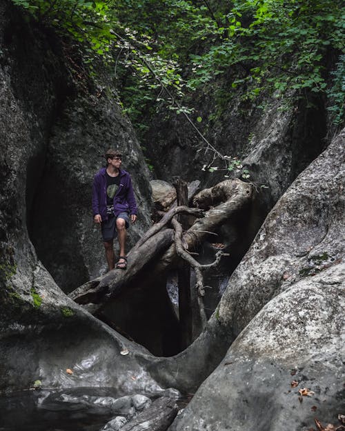 Man Walking in Canyon in Wild Nature Forest