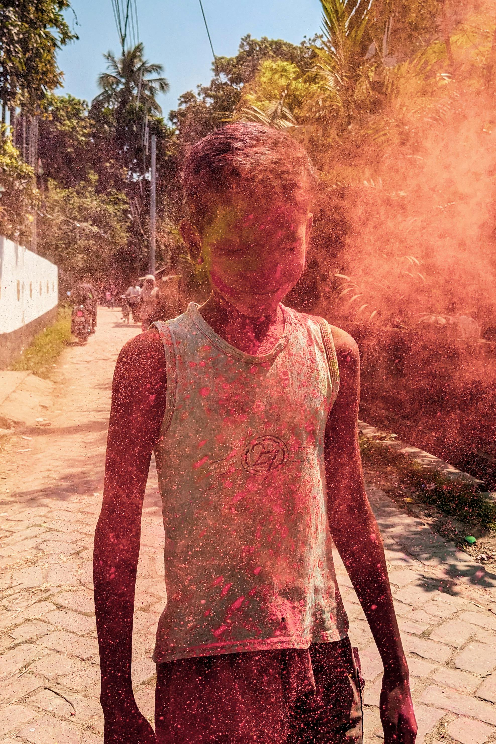 boy hit by a cloud of red powder