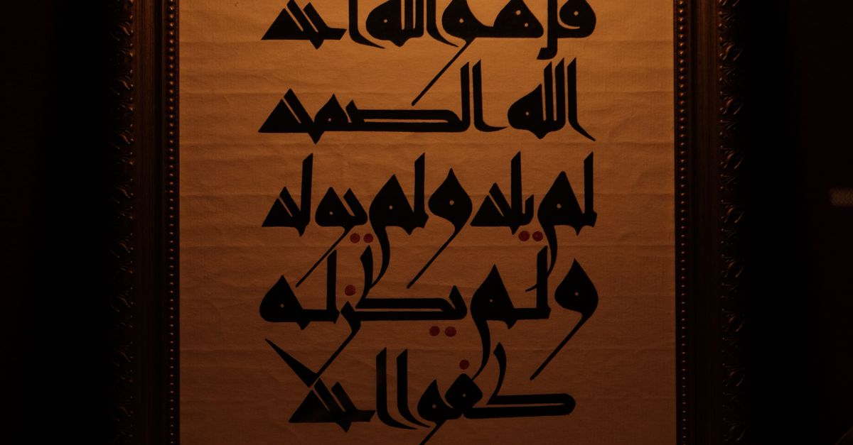 Classical Arabic Scriptures Old Arabic Scripture in Museum Showcase · Free Stock Photo