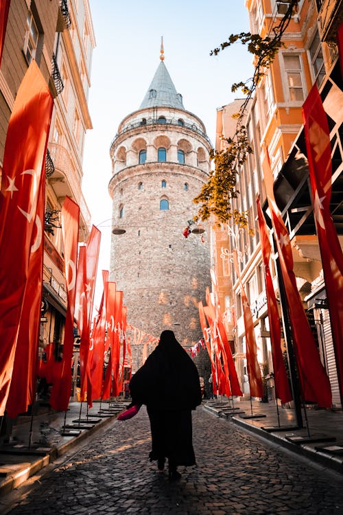 Woman Walking to the Galata Tower in Istanbul