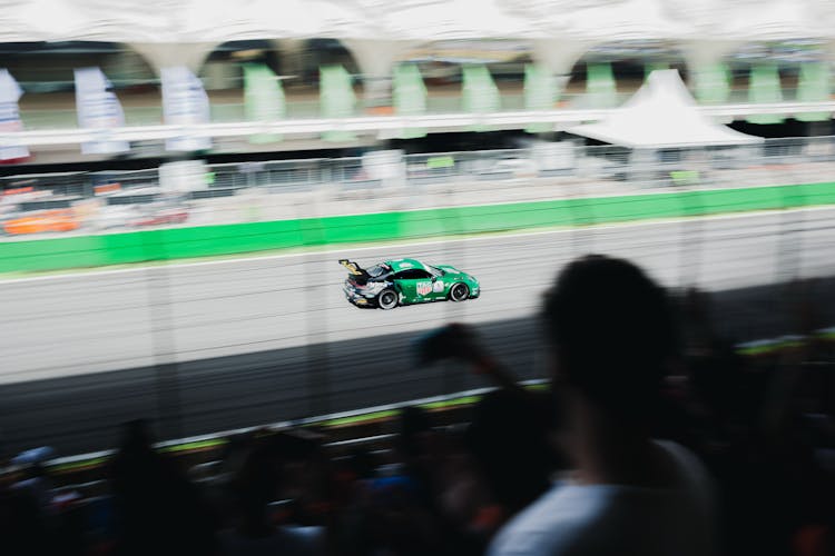 Racing Car Running On Race Track