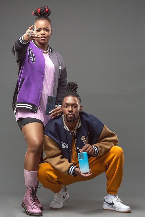 Studio Shot of Two Young People in Casual Outfits 