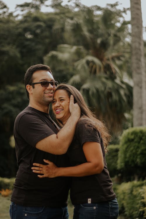 Couple Hugging in a Tropical Garden 